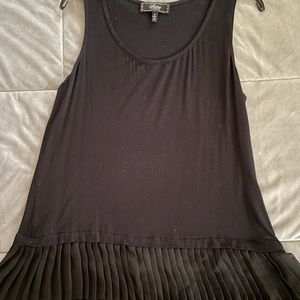 Black sleeveless top.